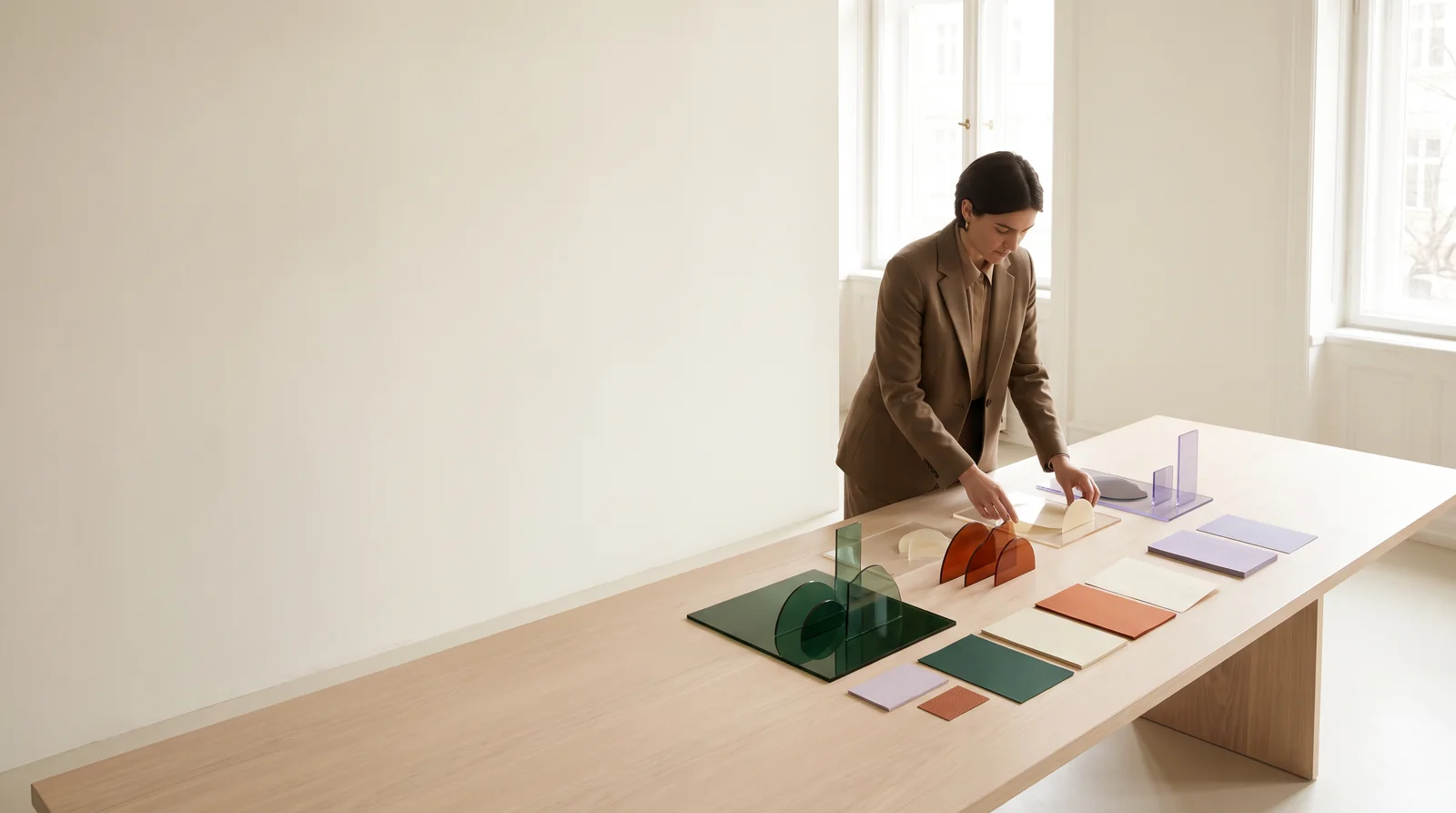 Researcher arranging paper materials on a table