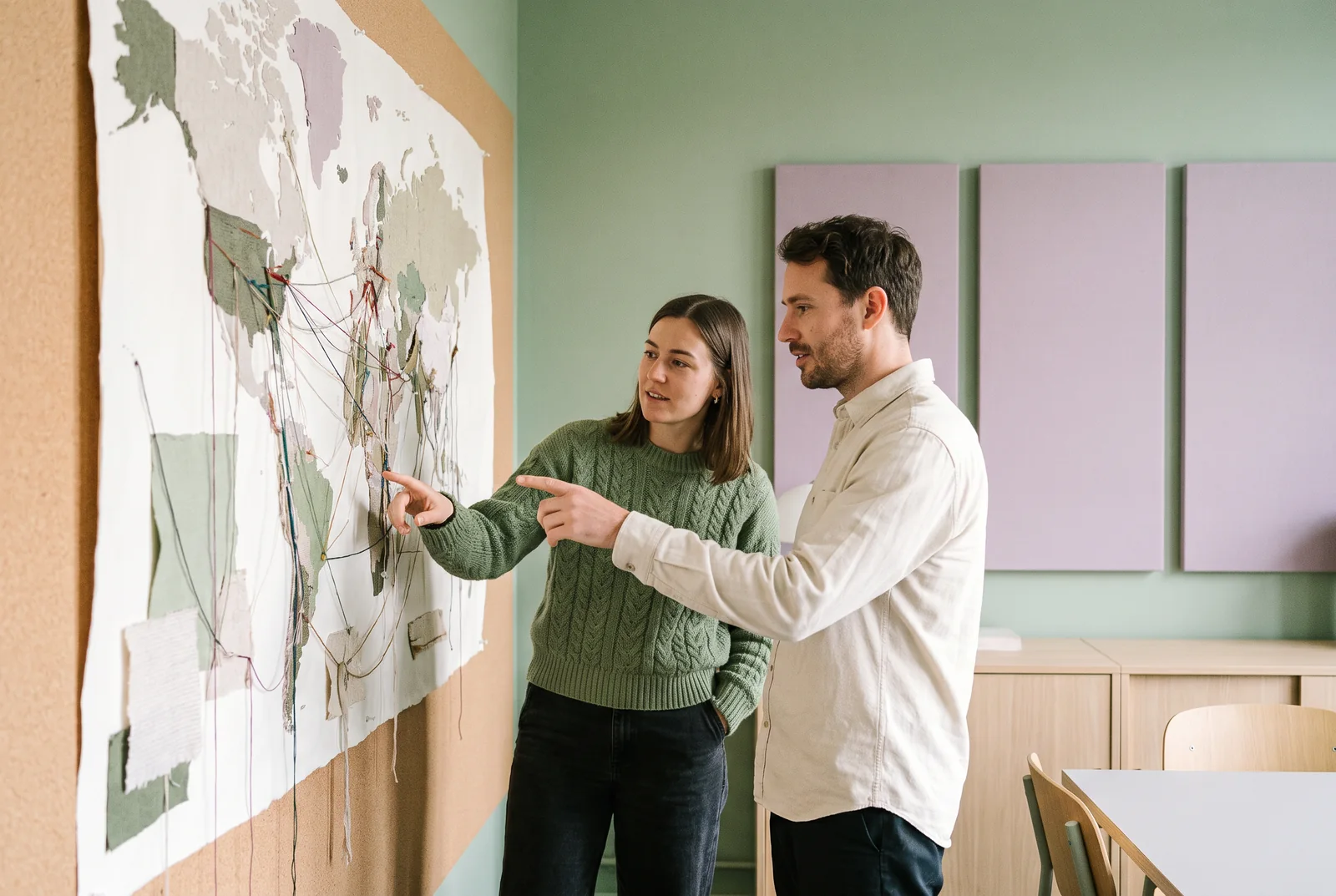 Researchers reviewing a large map